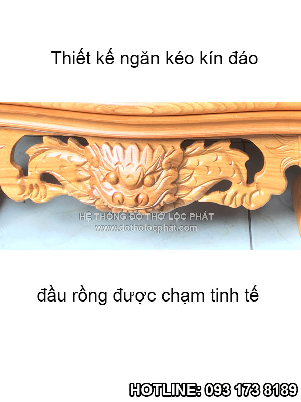 phần đầu rồng và ngăn kéo bàn thờ thần tài mái chùa được chạm tinh tế