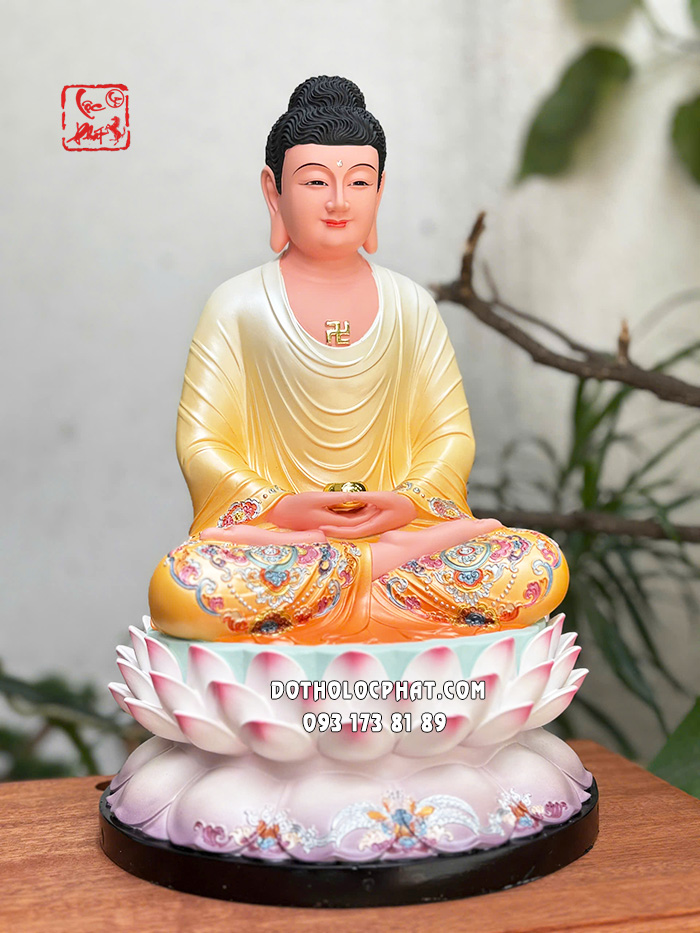 Tượng Phật A Di Đà áo vàng đế sen hồng bằng composite