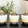 chum-nuoc-tho-cung-da-ngoc-trang-boc-hop-kim-mau-dong-1